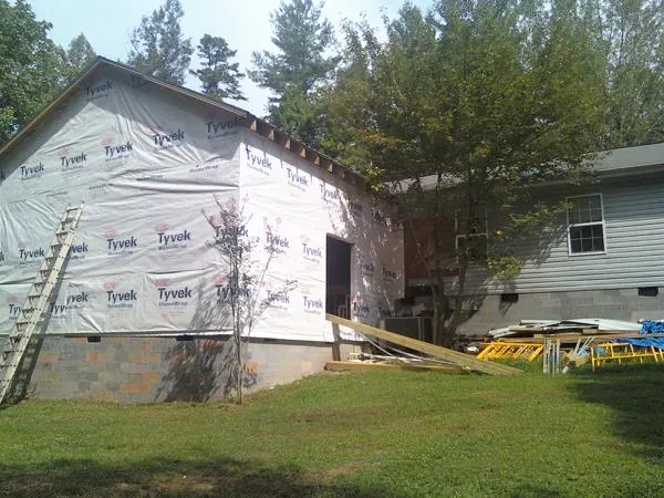 Tyvek wrapped gable on a new room addition beside an existing home in Etowah